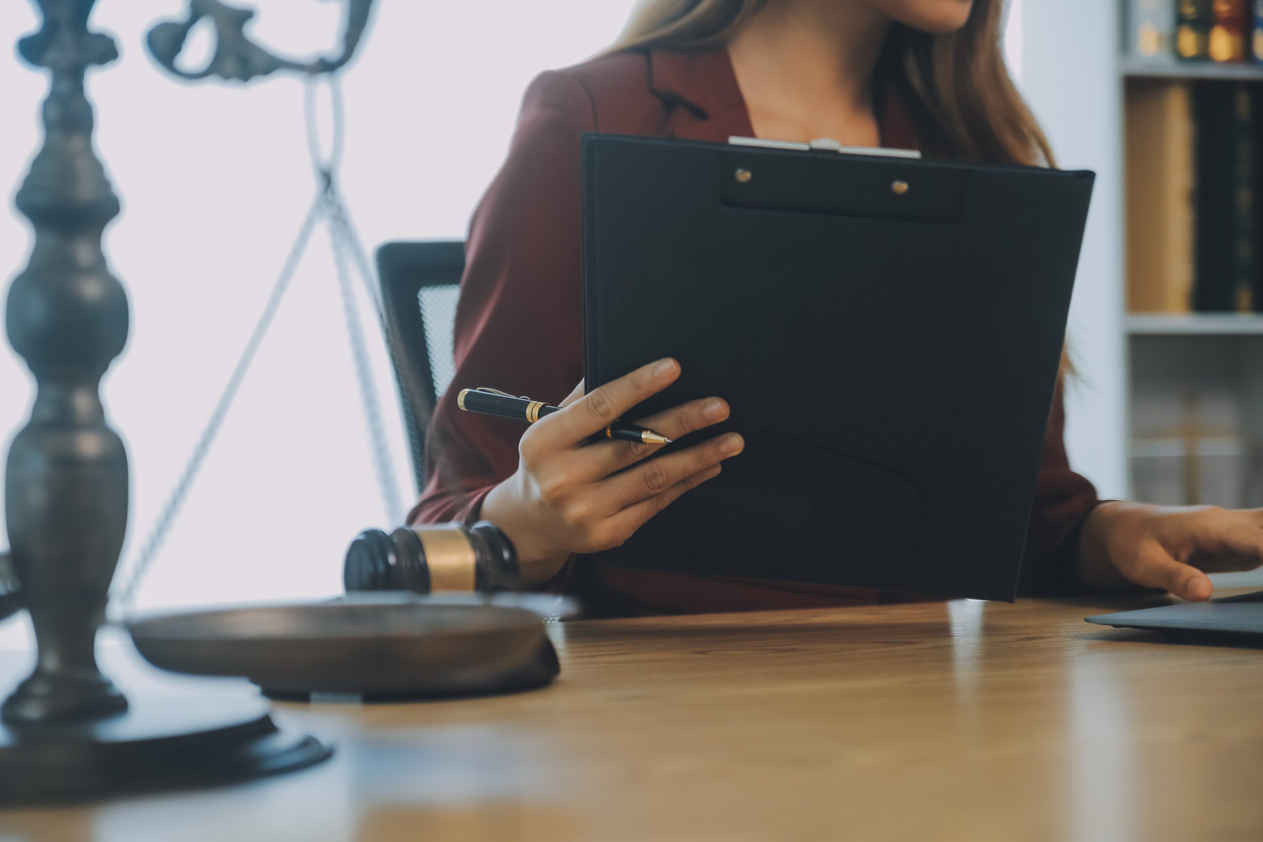 Lawyer, legal advisor, businessman brainstorming information on agreement details Business contracts in legal processing books for accuracy in contract documents. joint financial investment.