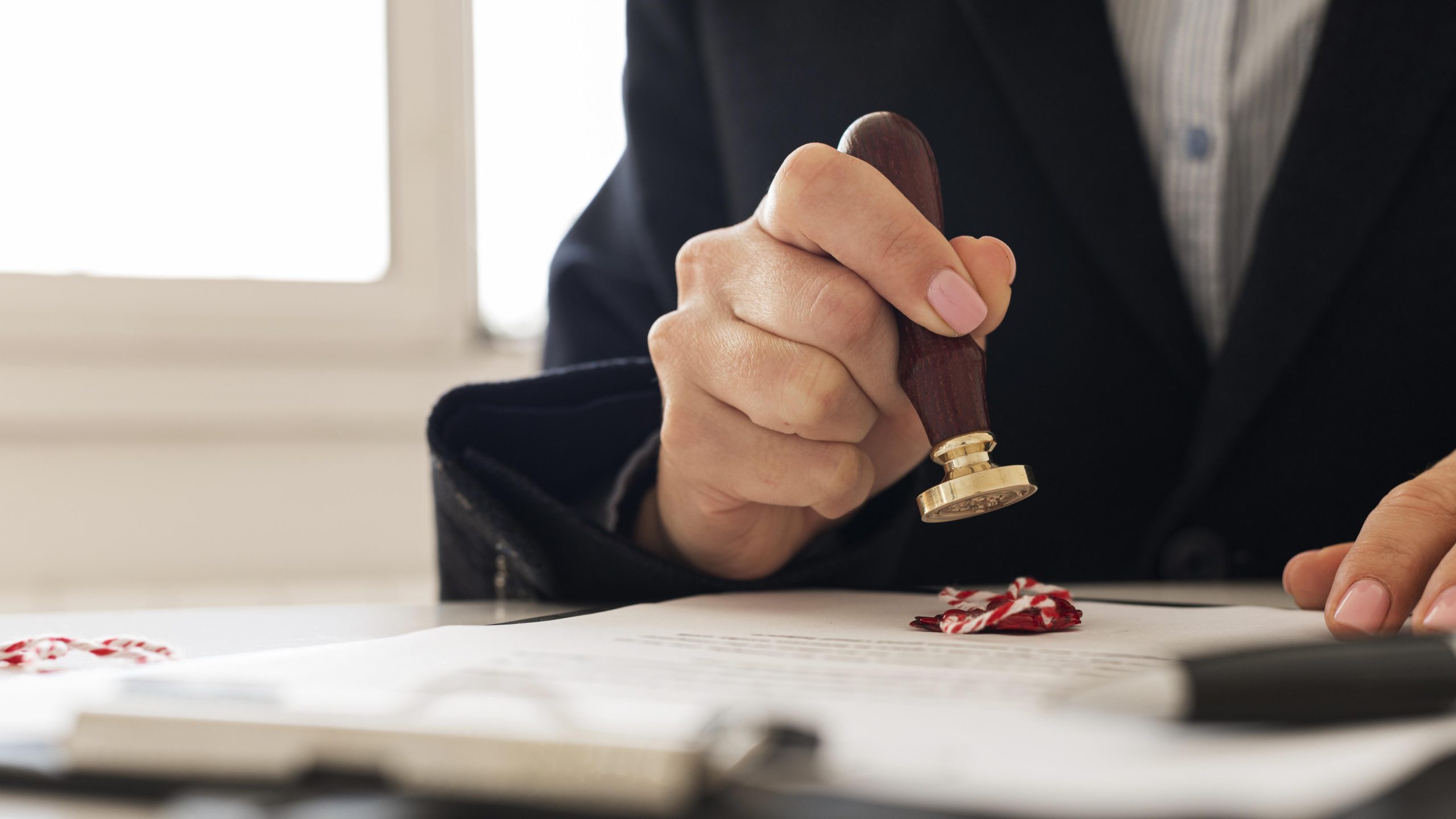 person-using-wax-seal-certificate